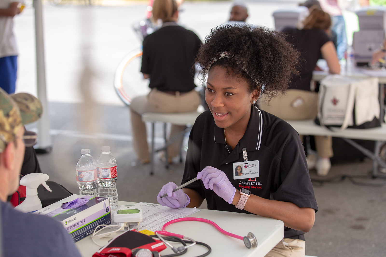 UL lafayette nursing student consulting with a patient at a clinic