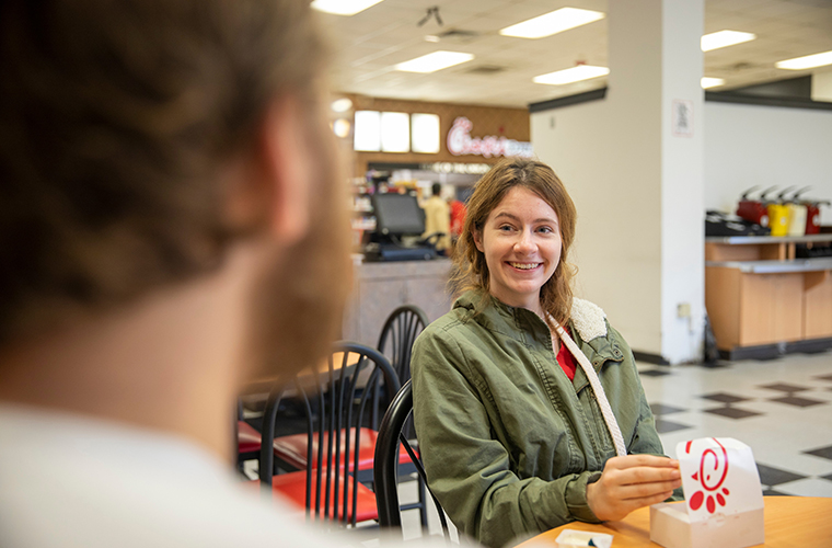 students eating chick-fil-a in dining hall