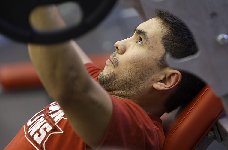 student lifting weights
