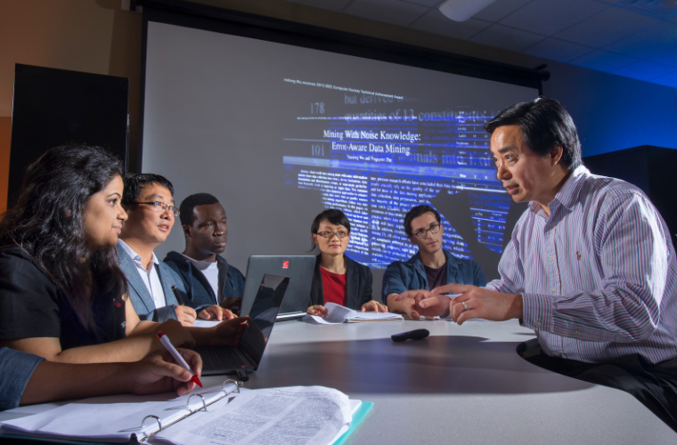 UL Lafayette professor teaching students in technological classroom