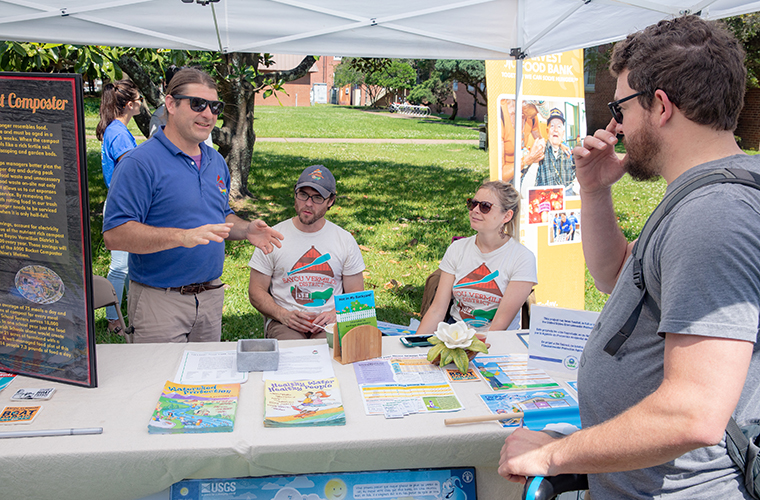 Student speaking to environmentalists about water protection