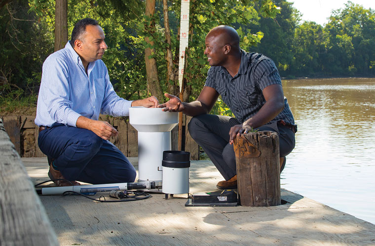 Two University of Louisiana research professors testing their sensor system to detect flooding
