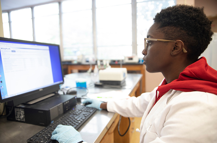 UL Lafayette psychology pre-med student in a lab