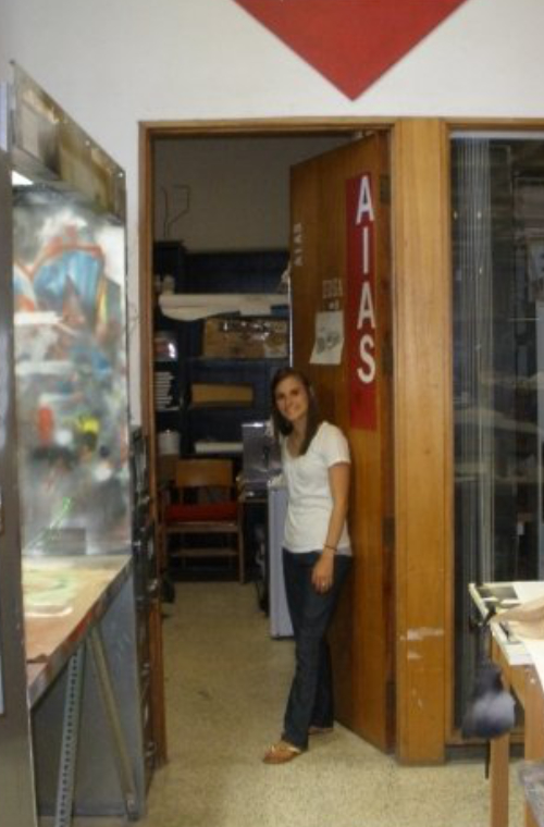 Ashley Bell Davis stands in the doorway of the American Institute of Architecture Students workshop on campus at the University of Louisiana at Lafayette.