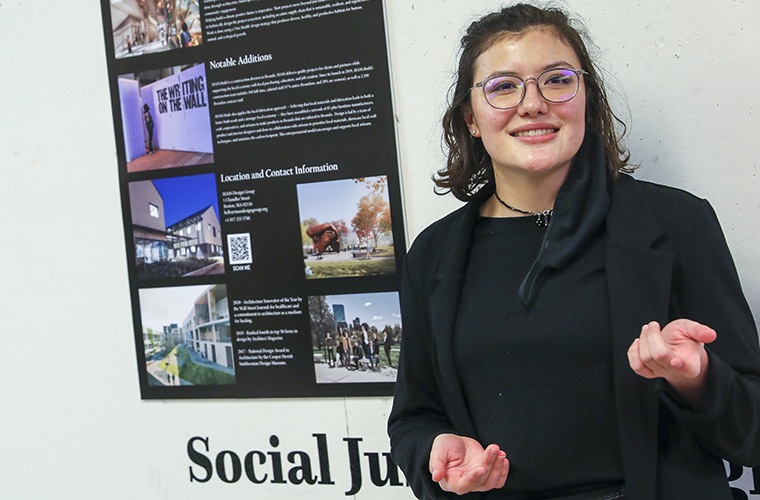 A University of Louisiana at Lafayette student presents a poster presentation of her research