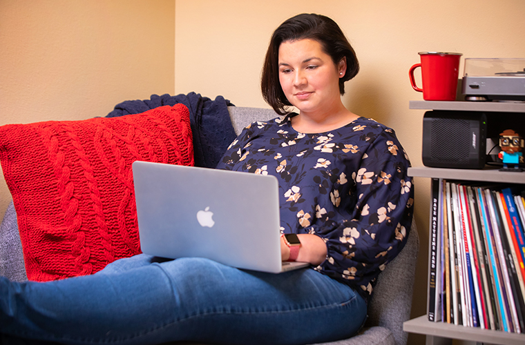 Student at laptop in home