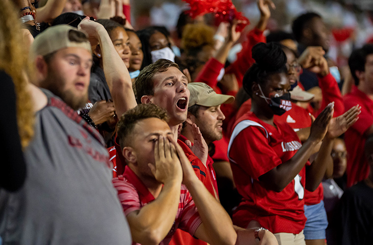 UL Lafayette students cheering for Ragin Cajun football team.