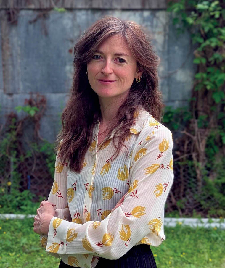 Dr. Gwendolen von Einsiedel poses with her arms crossed.