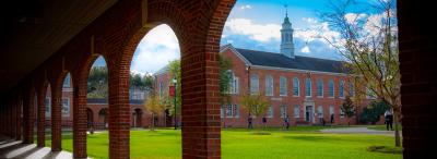 A view of the University of Louisiana at Lafayette Stephens Hall through the arches of the alumni Walk of Honor