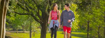 Two University of Louisiana at Lafayette students walking on the track around girard park