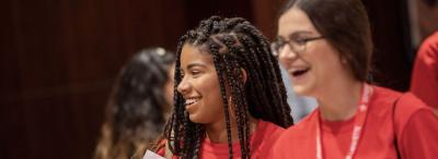 Two young women smiling and laughing at a University of Louisiana at Lafayette preview day event for prospective students