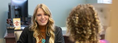 UL Lafayette counselor speaking with a UL Lafayette student during a counseling session.