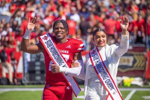 TJ Wisham walks across Cajun Field as Homecoming King in 2021. Wisham earned his MS in Systems Technology online.
